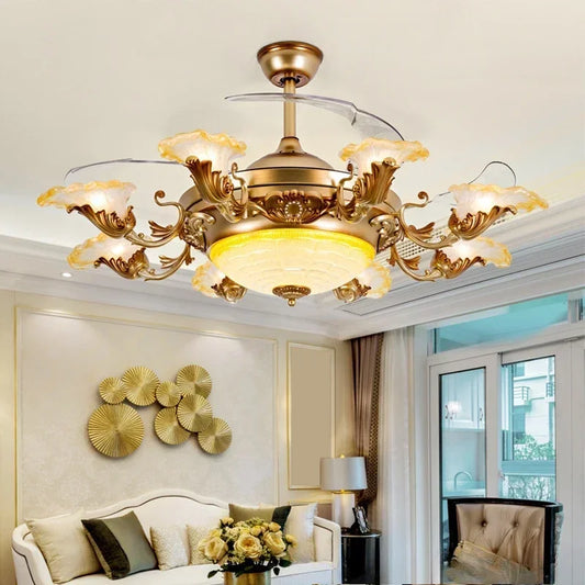 A lifestyle shot of a gold ceiling fan light with floral crystal details, installed in a living room above a sofa.