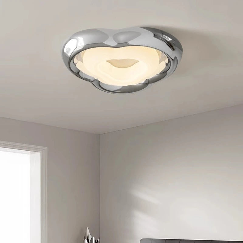 A view of the chrome wave ceiling light fixture from a different angle in a bedroom.