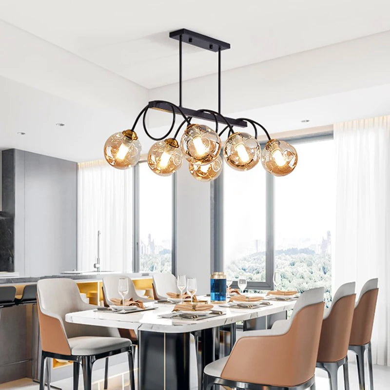 Modern dining room with a stylish chandelier and chairs.