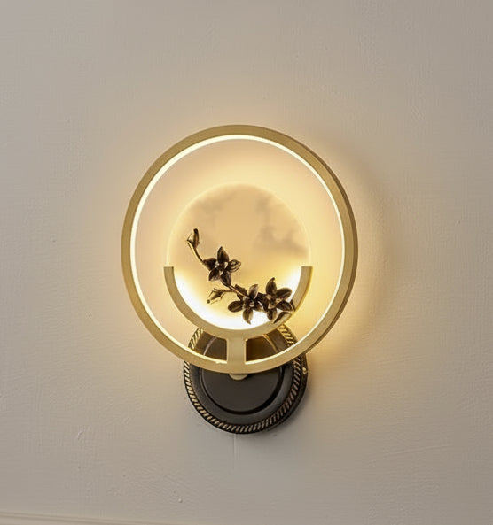 Decorative wall light with floral design on a white background