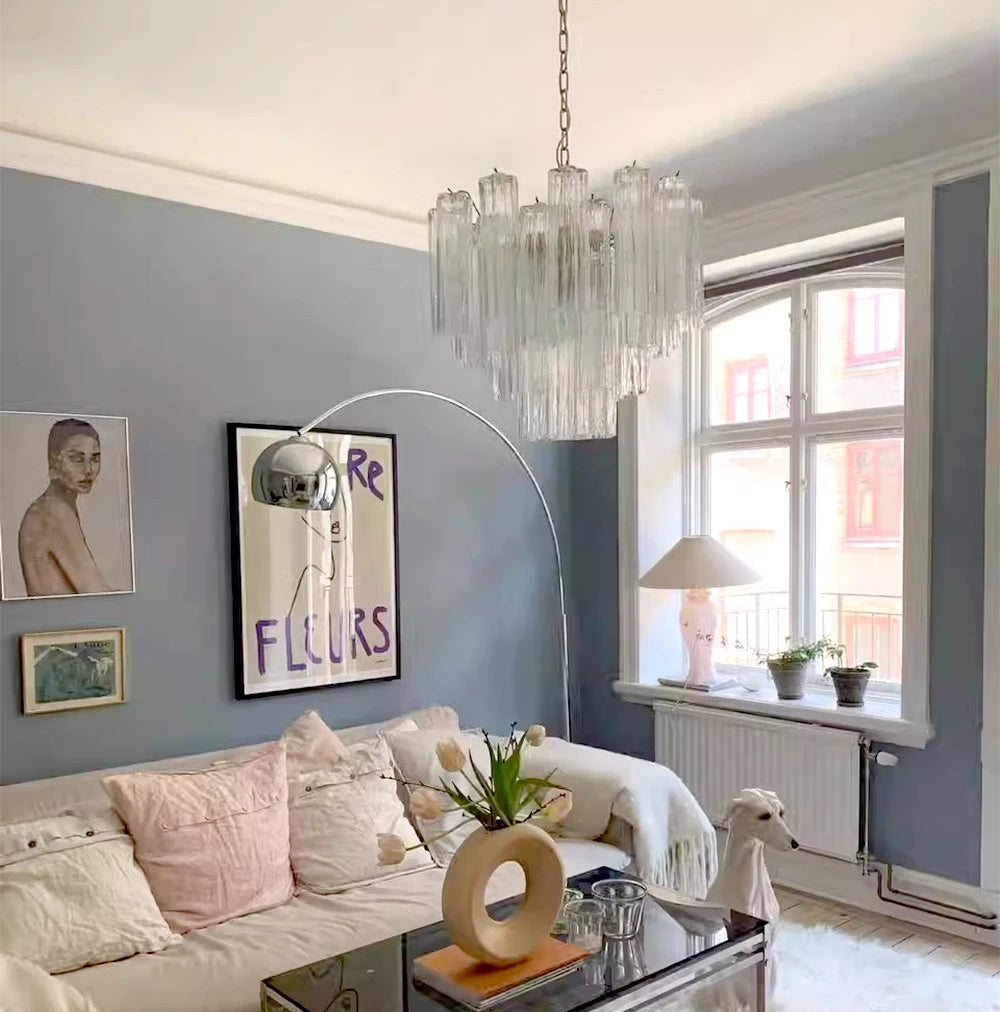 Modern living room with gray walls, white sofa, and decorative elements.