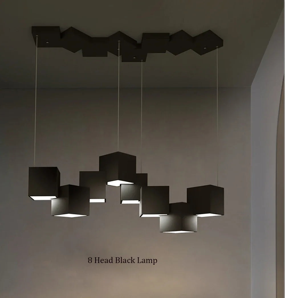 Modern black pendant lamp with 8 heads hanging in a room.