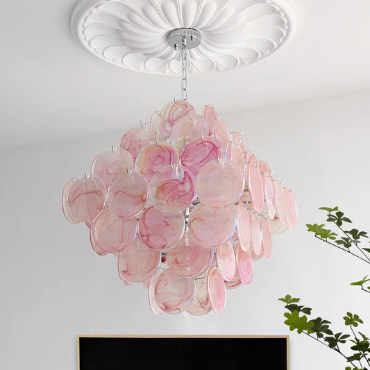 A pink glass petal chandelier with a diamond-shaped arrangement, hanging from a decorative ceiling medallion.