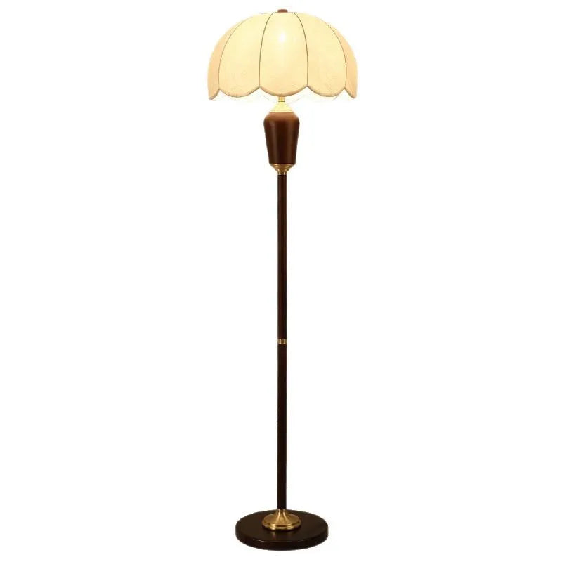 Floor lamp with a beige lampshade on a white background