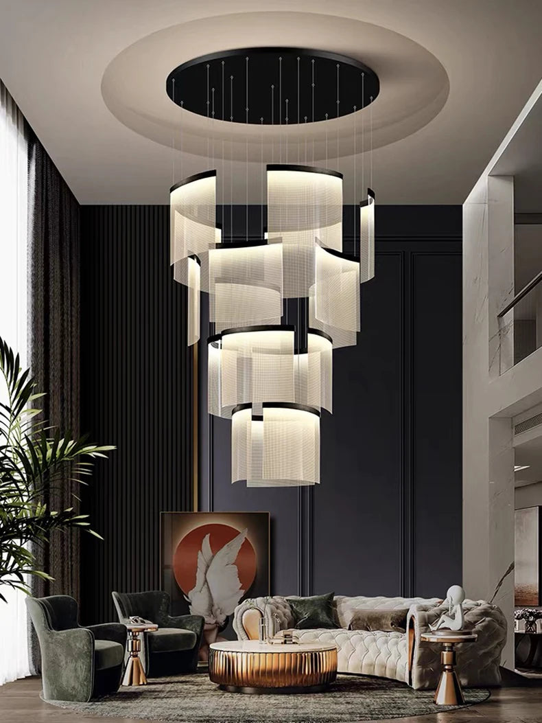 Modern living room with a stylish chandelier, sofa, and decor elements.