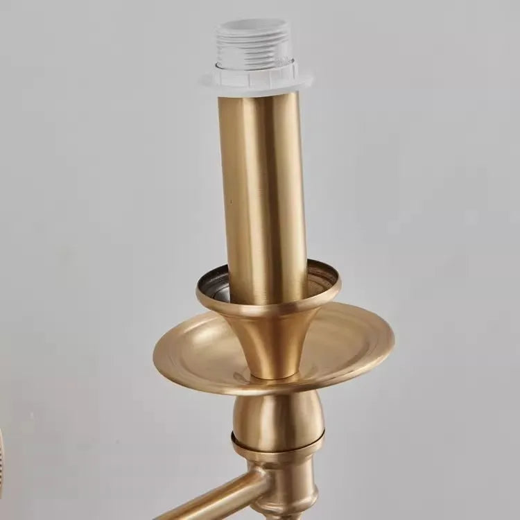 Gold faucet on a gray background