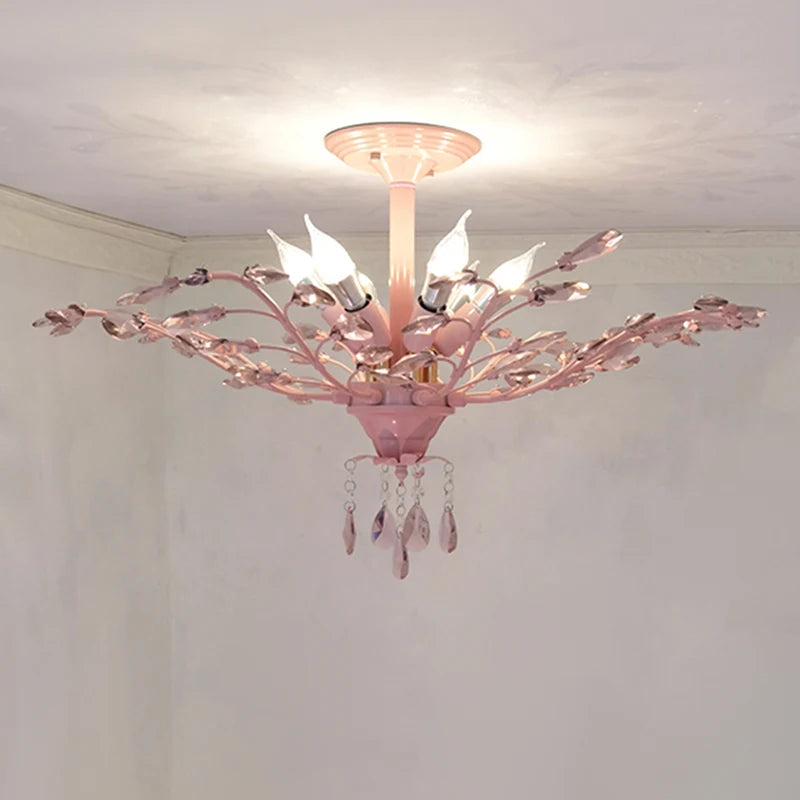 Side view of a pink floral semi-flush ceiling light with crystal accents and decorative light bulbs.