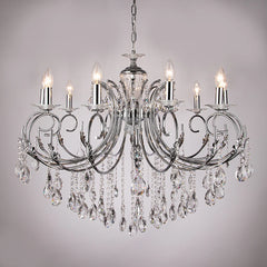 Polished gold candelabra chandelier with cascading crystals and candle-style lights, shown against a light gray background.