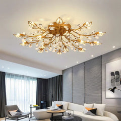 Gold crystal leaf semi-flush ceiling light fixture with cool lighting in a living room