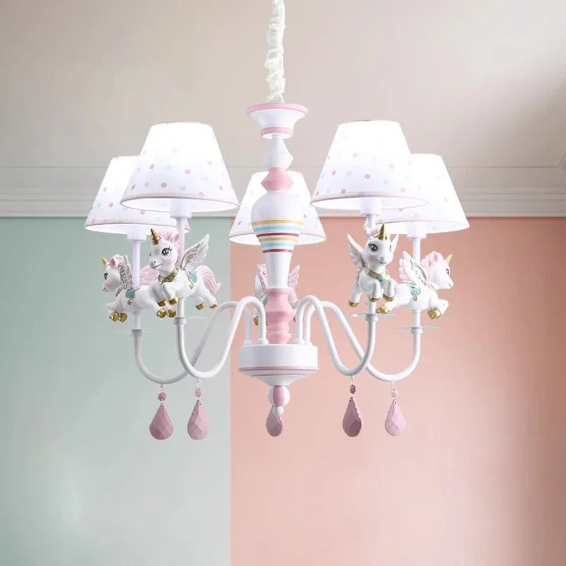 Unicorn chandelier installed in a room with pastel pink and green walls.