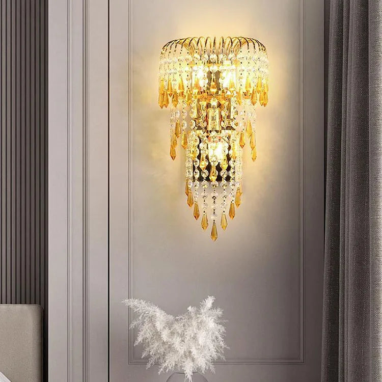 Decorative wall light fixture with crystal details on a wall.