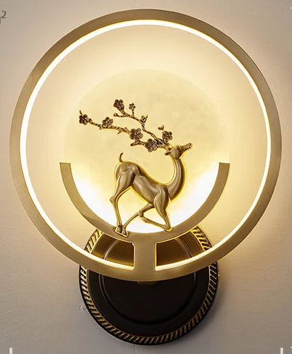 Decorative wall light fixture with deer design on a neutral background