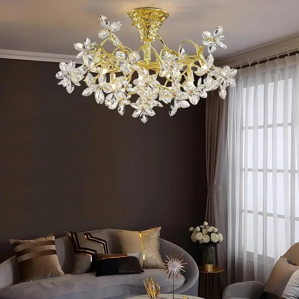 Luxurious chandelier hanging in a living room with a sofa and window.