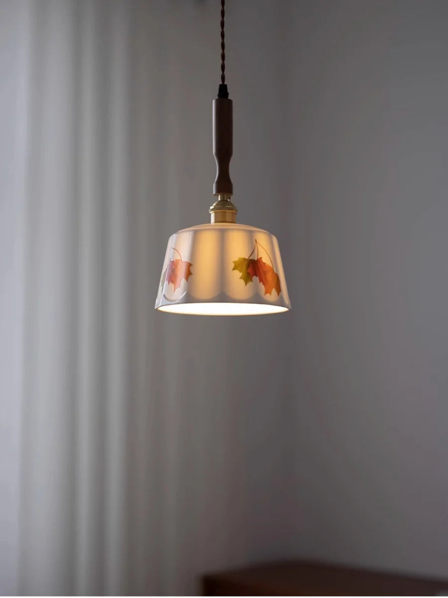 Pendant light with floral design on a plain background