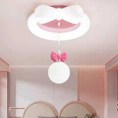 View of the white and pink bow flush mount ceiling light from a slightly lower angle, highlighting the playful design.