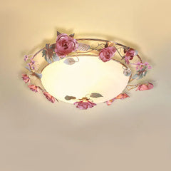Pink rose bud floral design semi-flush ceiling light with frosted glass diffuser against a plain ceiling