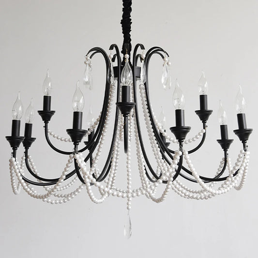 A black, multi-arm chandelier adorned with strings of white pearl-like beads and clear crystal teardrops, featuring candelabra-style light sockets against a plain white background.
