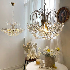 Gold floral crystal chandelier pendant light fixture with curved arms and clear crystal flowers, hanging in a well-lit room.