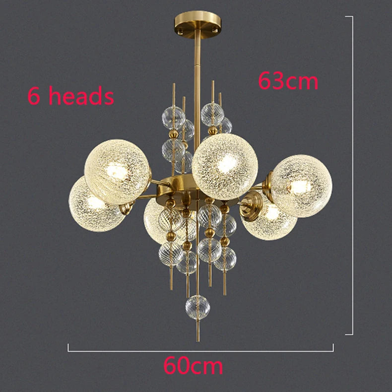 Chandelier with six glass globe lights on a dark background, showing dimensions.