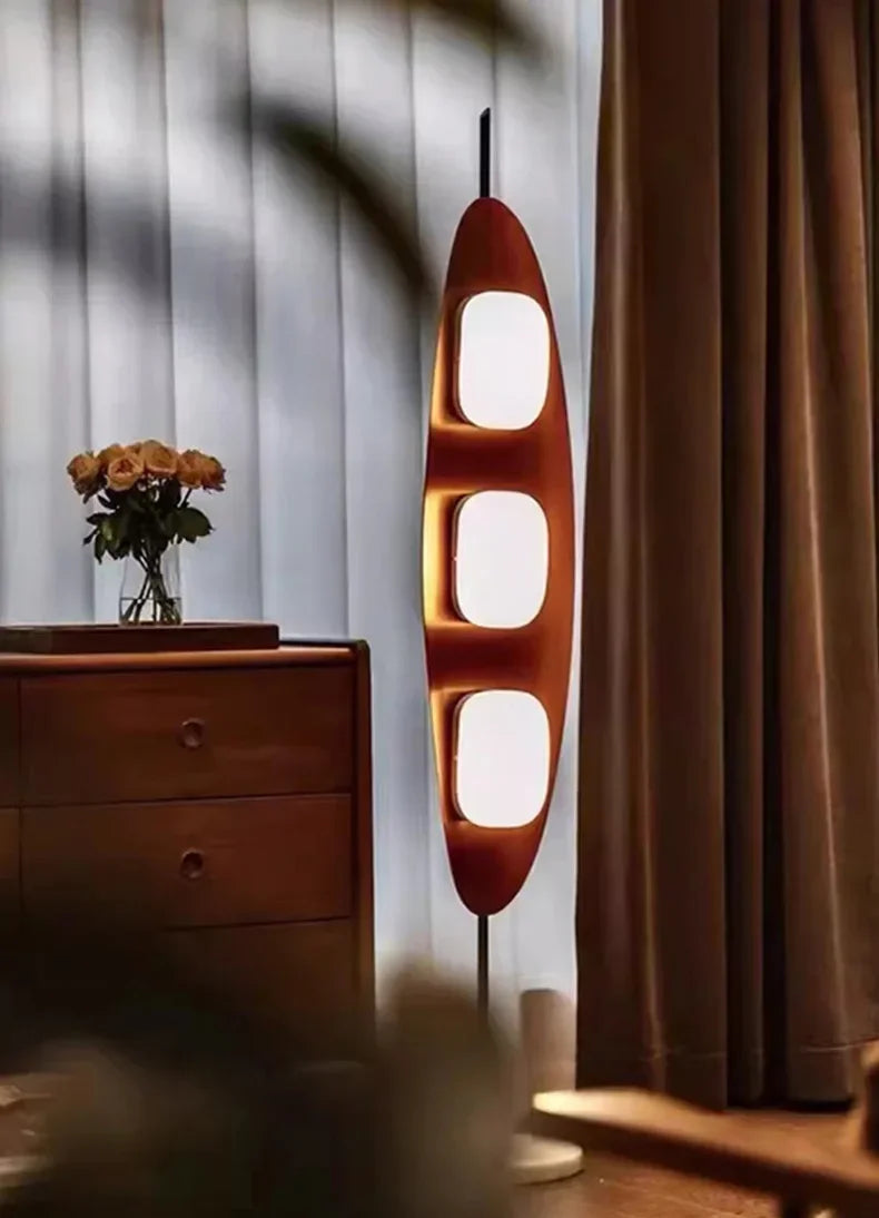 Modern floor lamp with a unique design in a room setting.