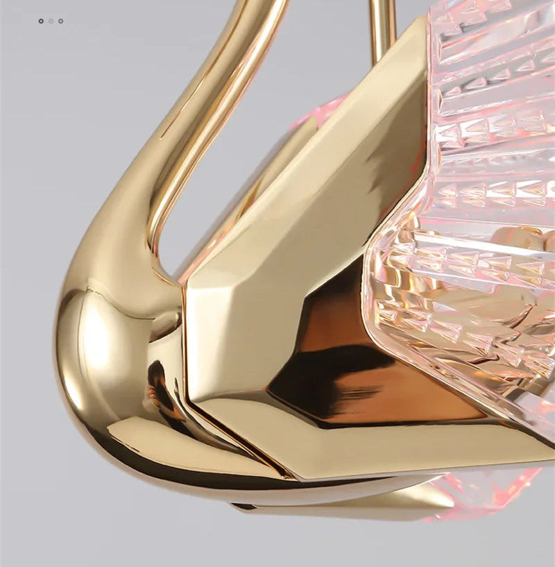 Gold and crystal decorative item with text on a gray background