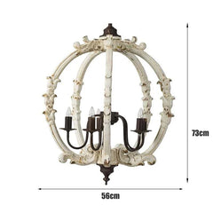 Dimensional diagram showing a distressed white carved wood globe chandelier with height 73cm and width 56cm.