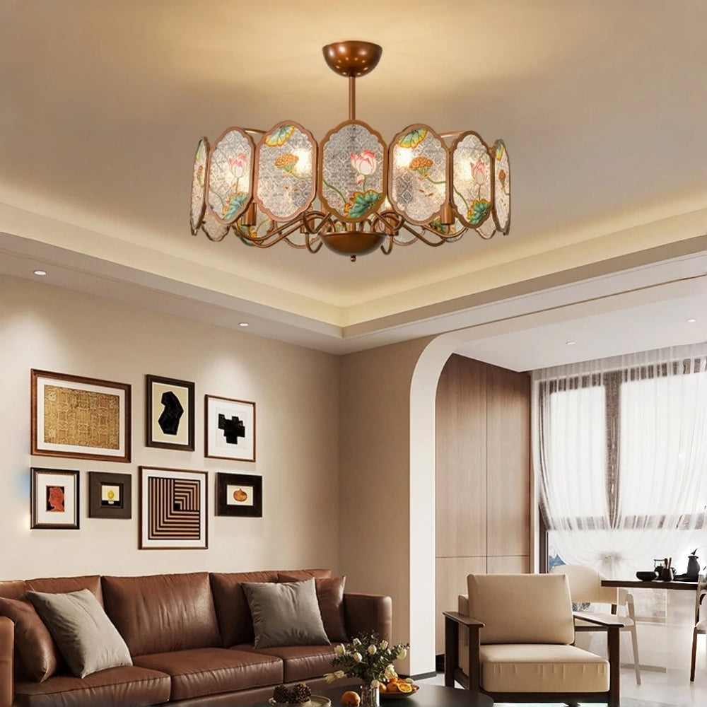 A copper frame chandelier with lotus floral acrylic panels hangs above a leather sofa in a living room setting.