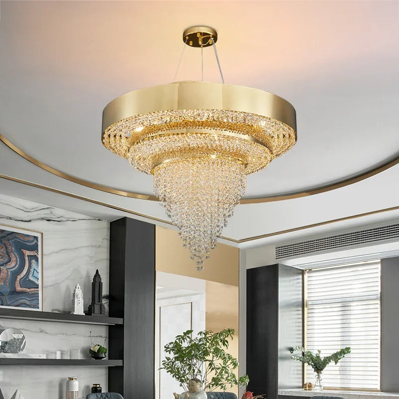 Close-up view of a gold tiered chandelier showcasing its intricate crystal design and polished gold frame.