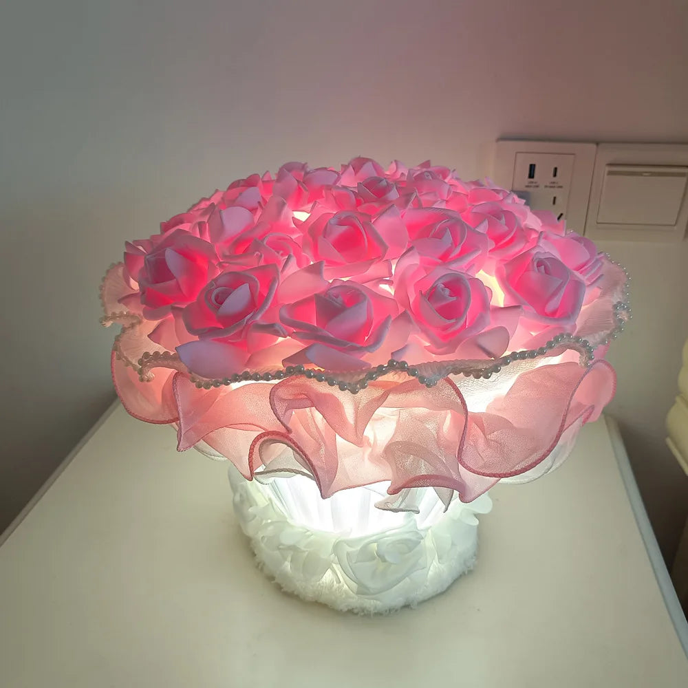 Decorative lamp with pink flowers on a white surface