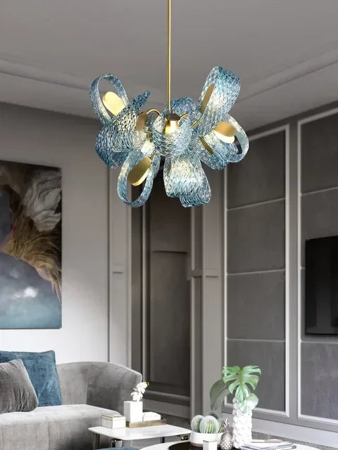 Modern chandelier with blue glass design in a living room setting