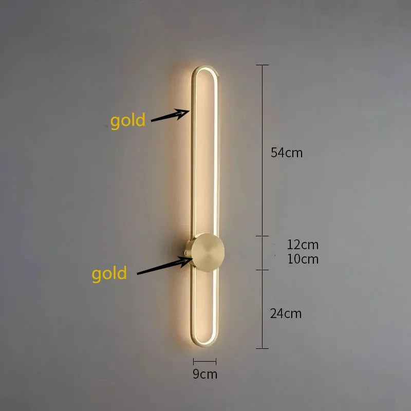 Gold wall light fixture with dimensions on a gray background