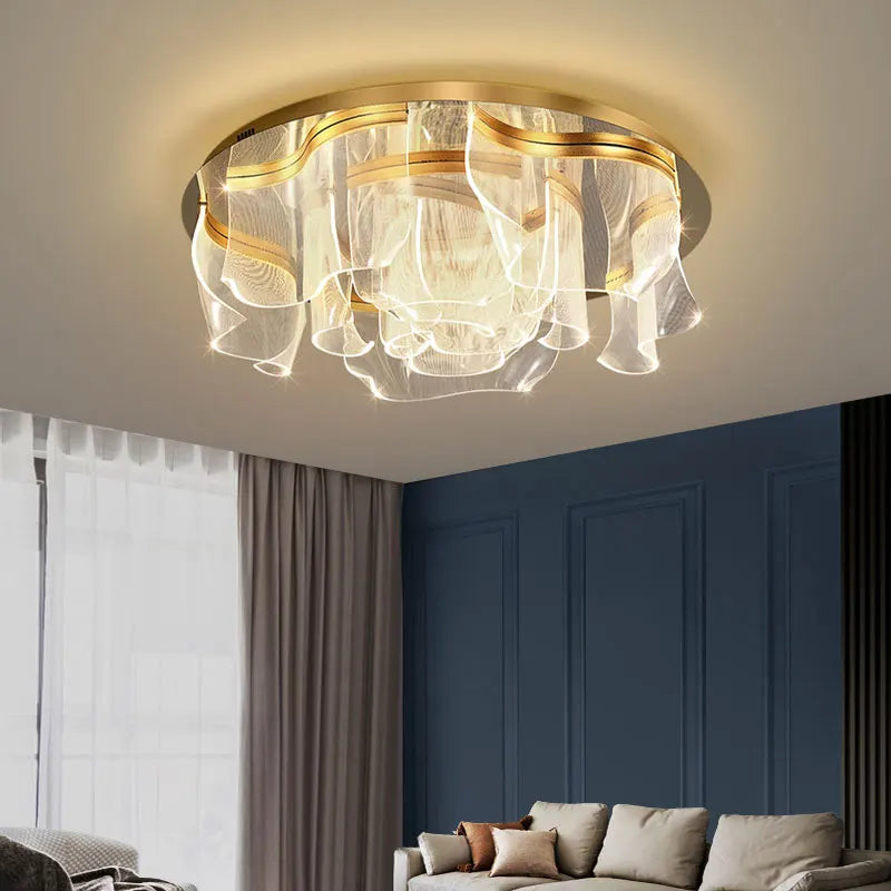 Close-up view of the gold floral wave LED ceiling light, showcasing its textured acrylic diffusers and polished gold frame.