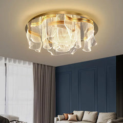 Close-up view of the gold floral wave LED ceiling light, showcasing its textured acrylic diffusers and polished gold frame.