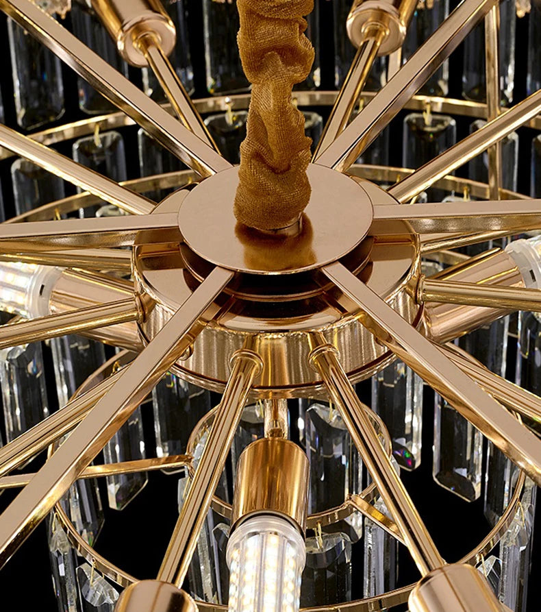 Gold chandelier with crystal accents on a dark background