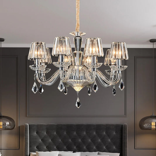 Close-up view of a crystal chandelier, showing the intricate details of the crystal shades and arms.