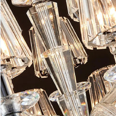 Detail shot of the faceted crystal elements and the structure of a crystal chandelier.
