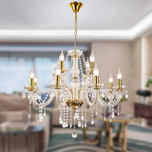 A gold-finished crystal candelabra-style chandelier with multiple arms and hanging teardrop crystals, illuminated and suspended from a ceiling.