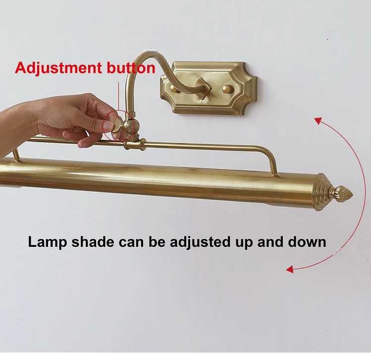 A hand is shown adjusting the knob on the arm of a gold-colored linear wall sconce, with text indicating shade adjustability.