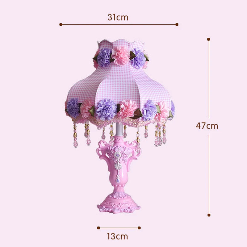 Decorative table lamp with floral design and measurements on a pink background