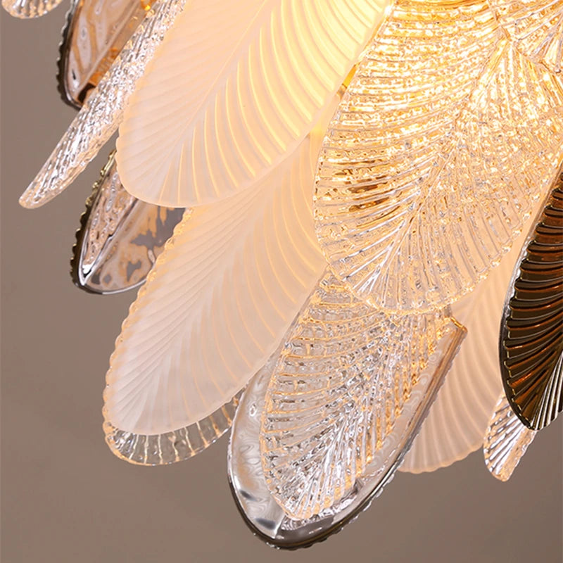 Close-up of a decorative ceiling light fixture with leaf-like designs.