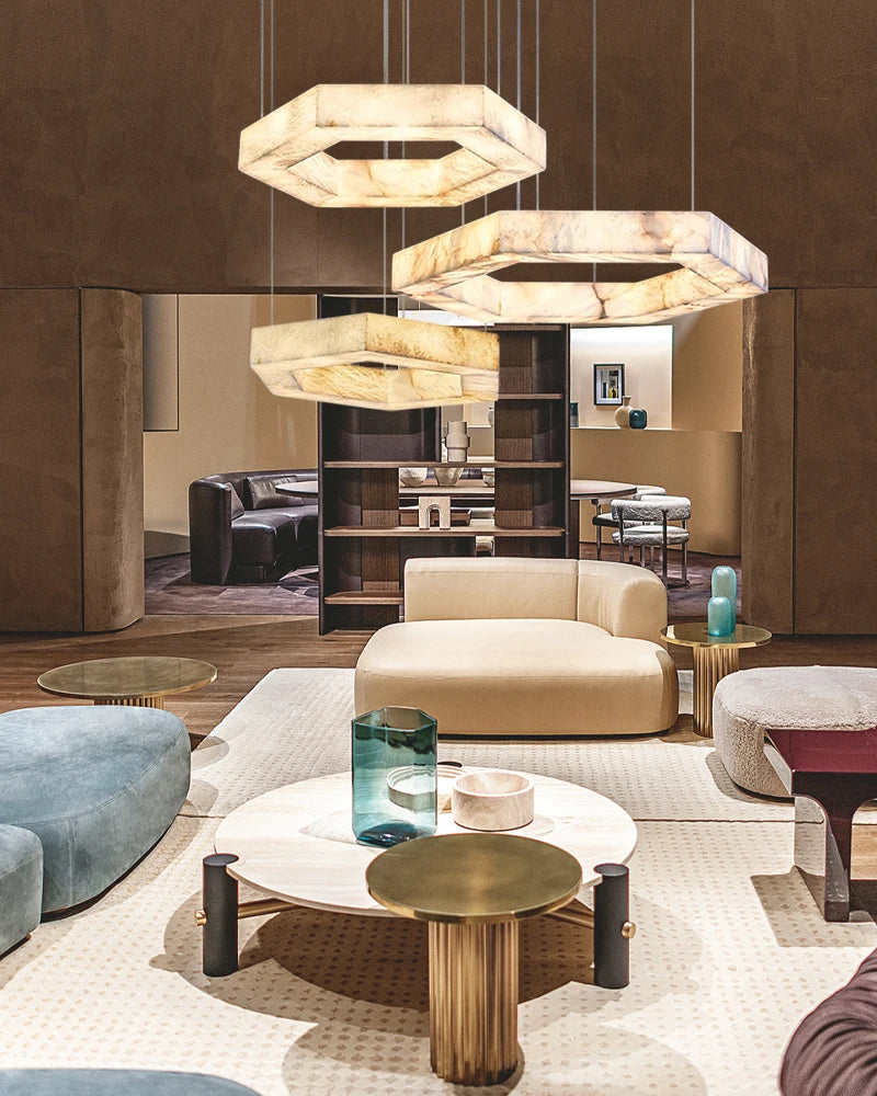 Modern living room with beige sofa, round coffee table, and pendant lights.