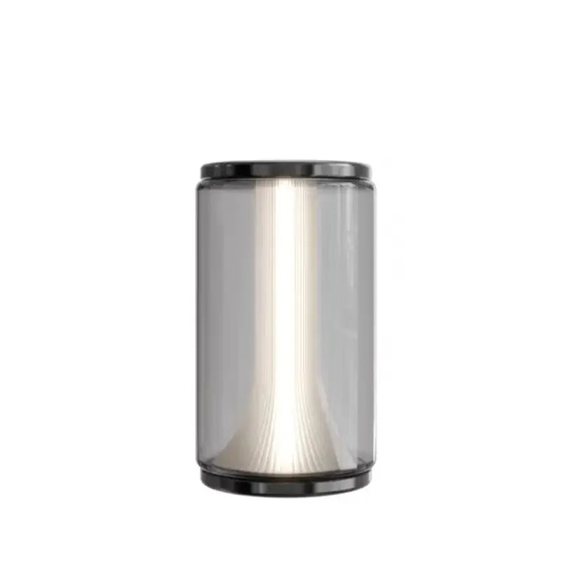 Cylindrical lamp with smoked glass shade on a white background