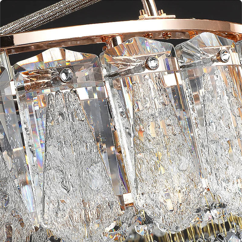 Close-up of a crystal chandelier with clear and gold accents