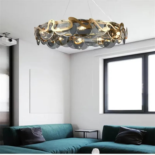 Gold wavy glass pendant light installed in a modern living room