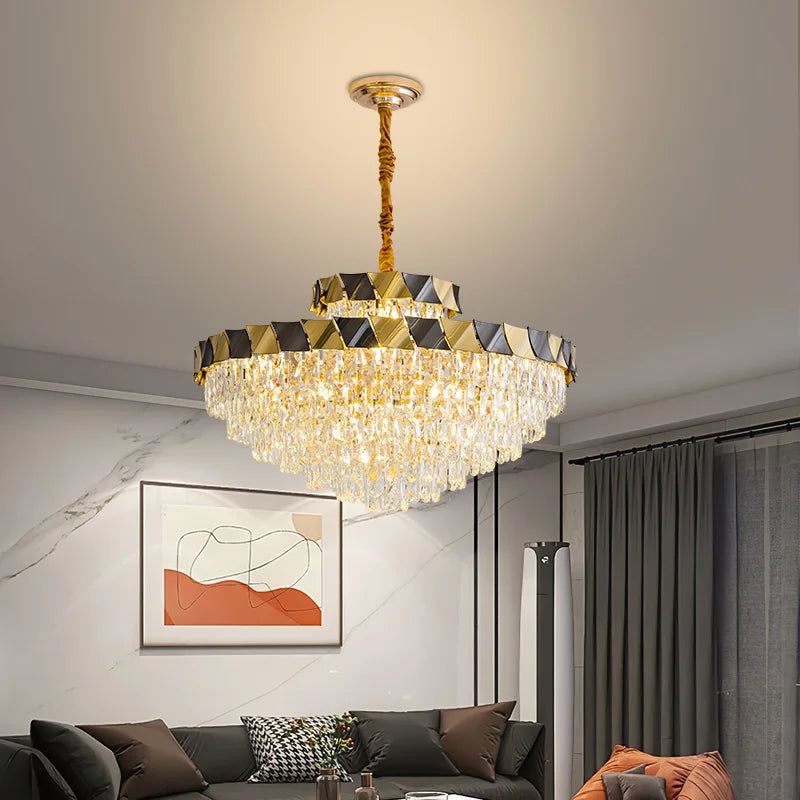 Close-up of the gold finish and crystal details on a tiered chandelier.