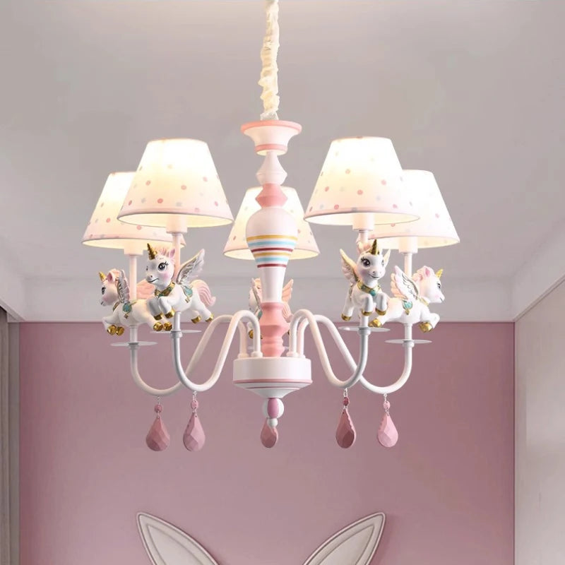 Unicorn chandelier in a pink-themed child's bedroom, providing soft illumination.