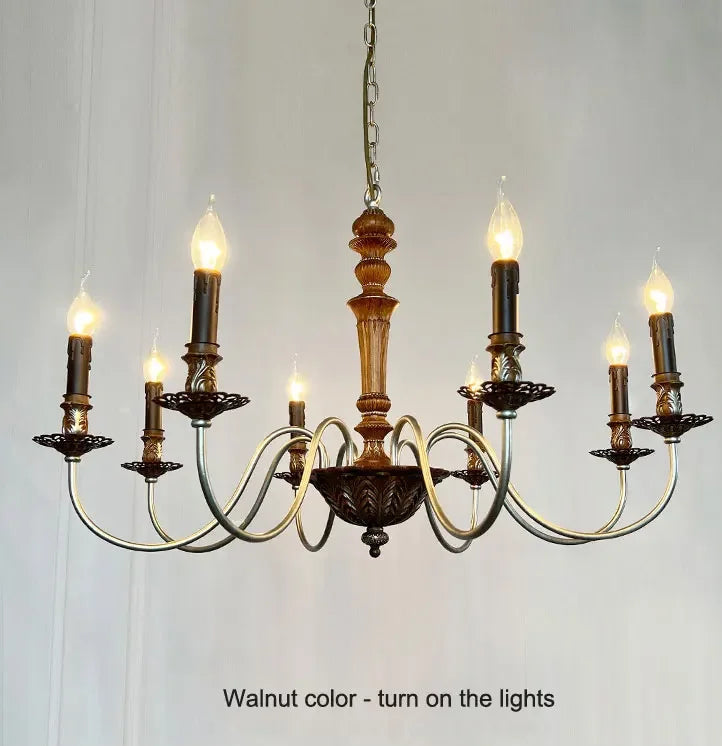 Wooden chandelier with multiple lights on a plain background