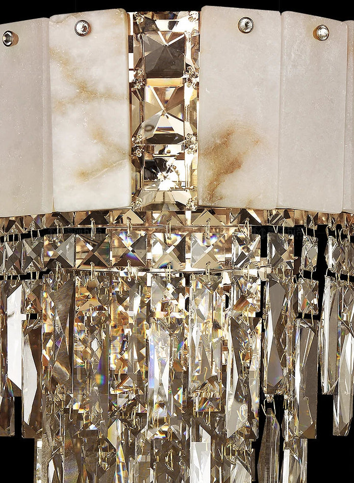 Luxurious crystal chandelier with marble accents on a black background