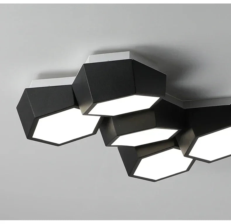 Modern ceiling light fixture with geometric design on a gray background