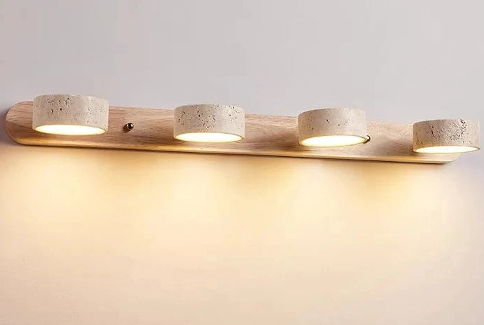 Wooden light fixture with four concrete-like lampshades on a neutral background